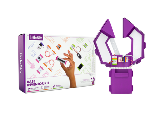 White rectangular box with colourful magnetic components designs and a hand holding a slide dimmer. Cardboard claw made from magnet components
