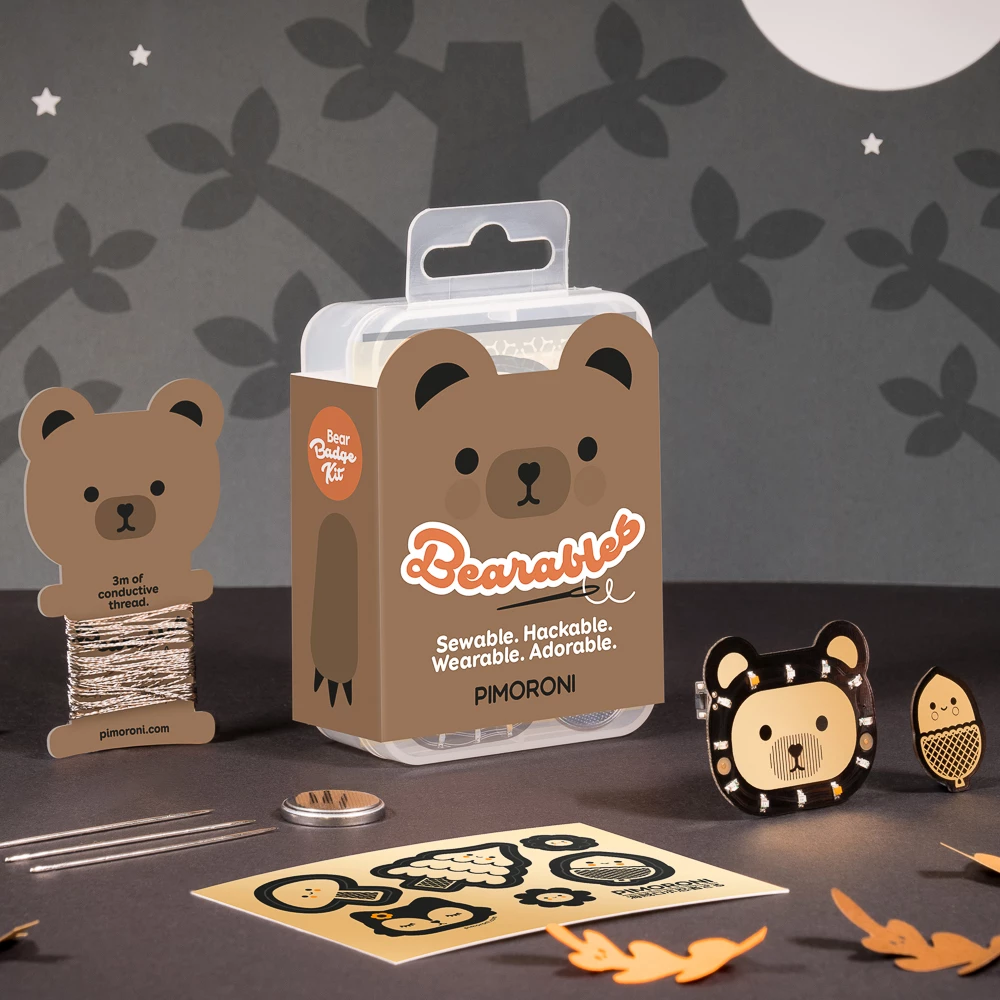 Colourful and cute brown bear packaging on a clear rectangular box with cute paper cutouts for kids